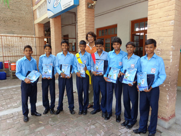 The students of St. Peter Boys High School of Sargodha receive new uniforms to reward their commitment